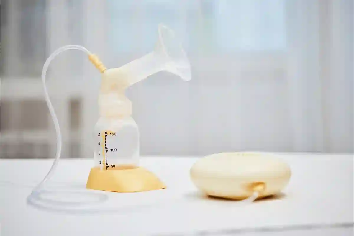 Electric battery-operated breast pump sitting on a table